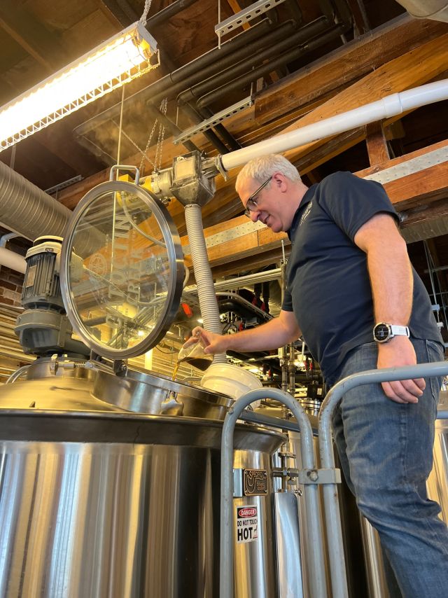 Image of individual making whisky.