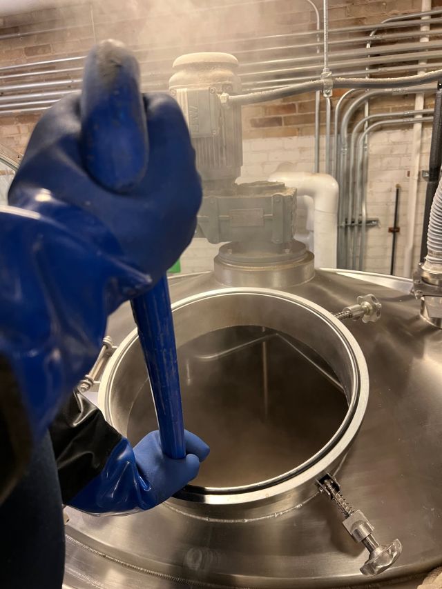 Image of individual making whisky.