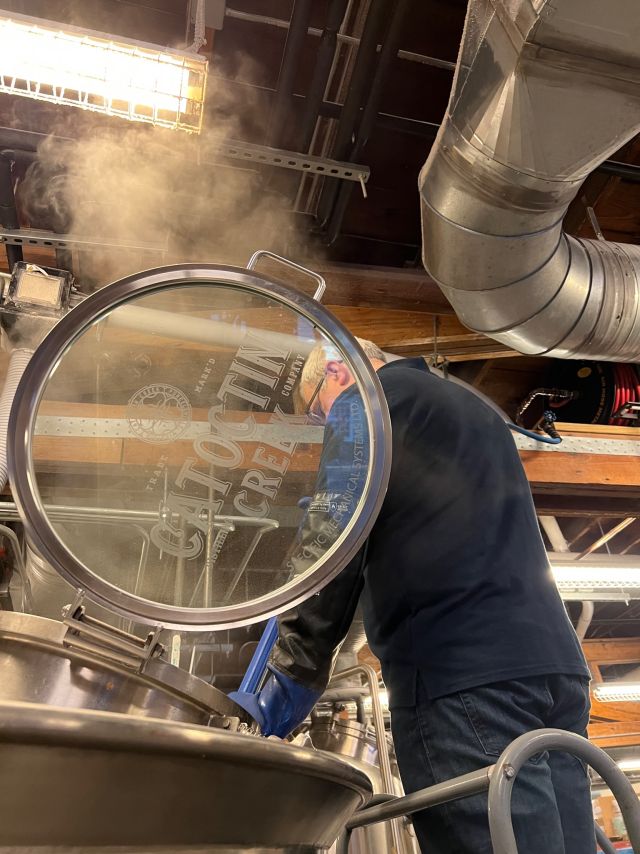 Image of individual making whisky.