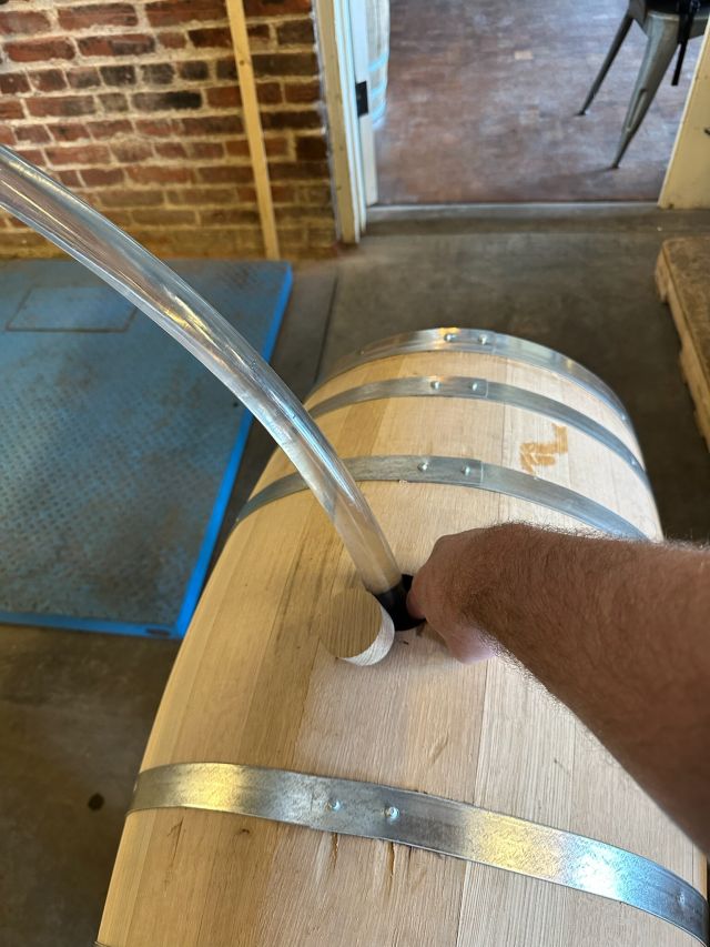 Image of individual making whisky.