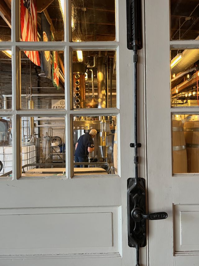 Image of individual making whisky.
